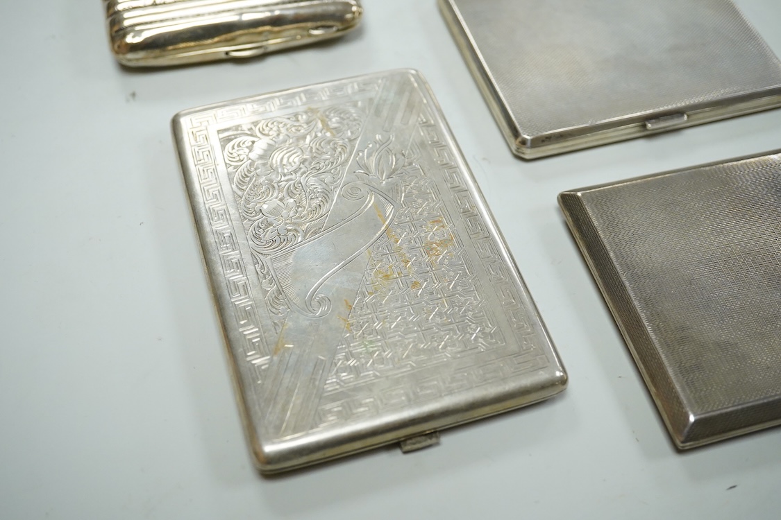 Nine assorted silver cigarette cases, including an Edwardian ribbed case and an engine turned rectangular case by Garrard & Co, Birmingham, 1960, 12.7cm, 32.1oz and one other unmarked white metal cigarette case.